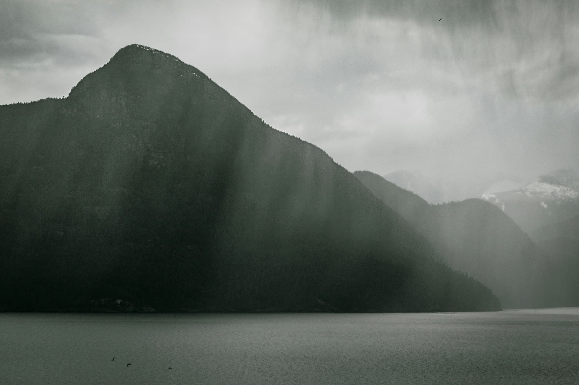 Rain moving across a mountain on Howe Sound