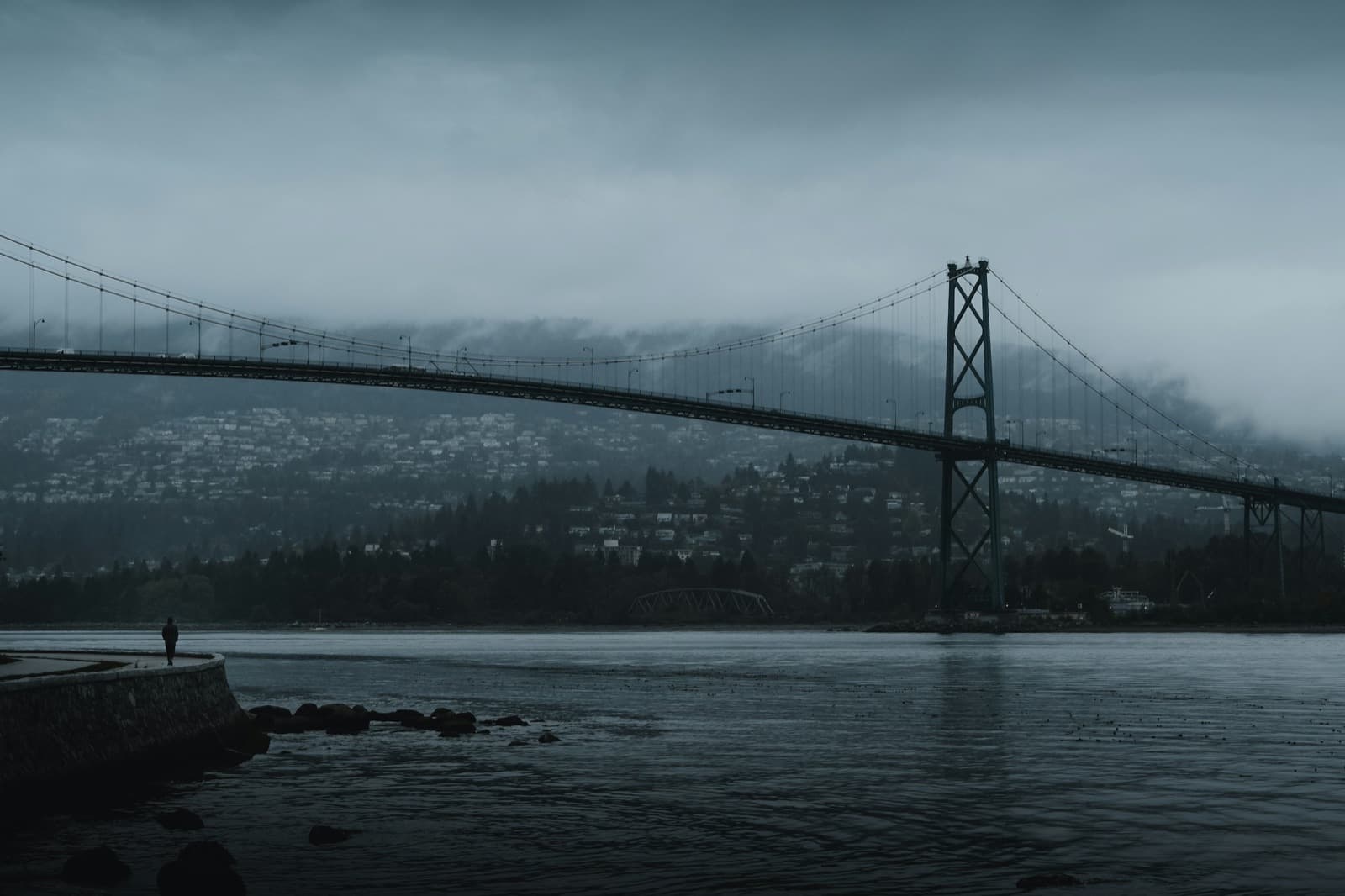 Lions Gate Bridge in low cloud over Burrard Inlet